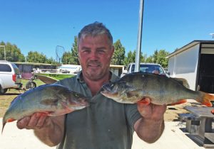 John Clements with a sample of the redfin from Lake Purrumbete (Picture: Lake Purrumbete Holiday Park).